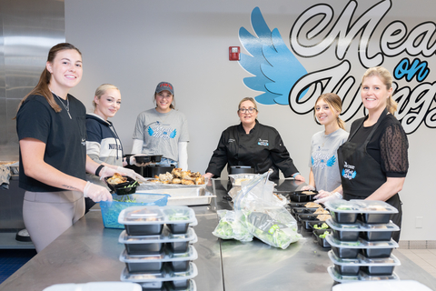 University of North Florida student volunteers and faculty prepare food for the Meals on Wings program, supported by Humana. The program helps increase the number of older adults who receive meal assistance, addressing food and nutrition security in communities in Florida, Kentucky and New York. (Photo courtesy of UNF)